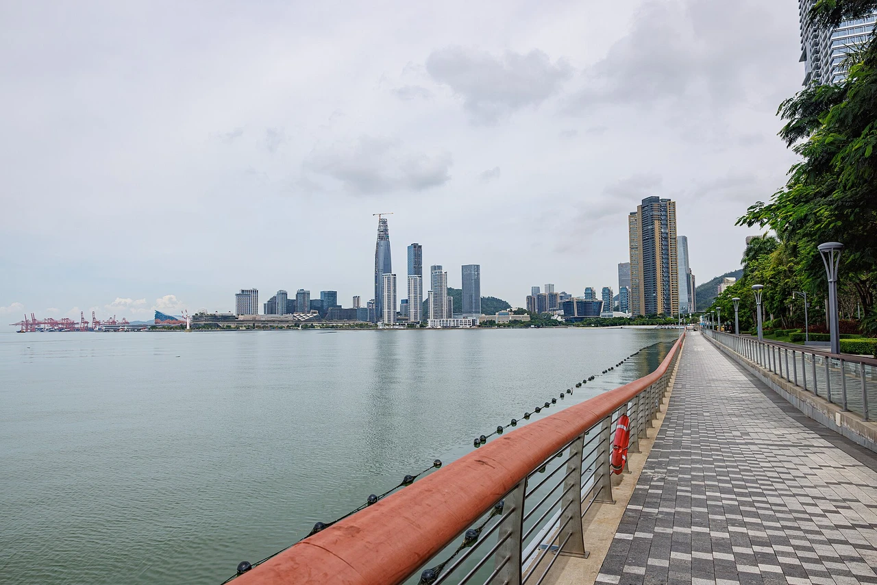 The boardwalk along Deep Bay, with the city across the water