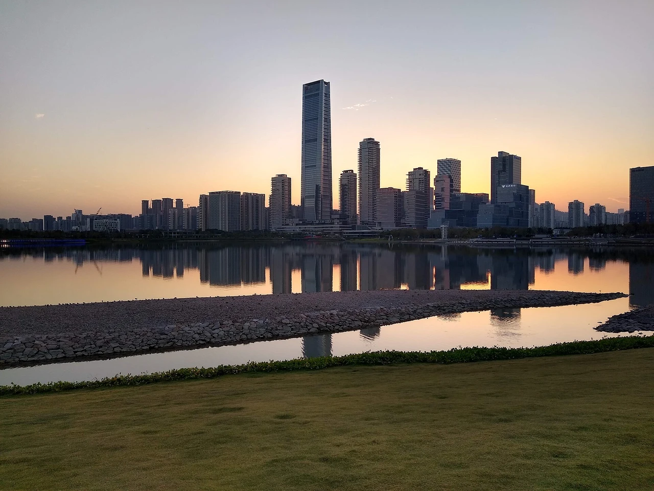 Sunset over the Houhai skyline from Shenzhen Bay Park