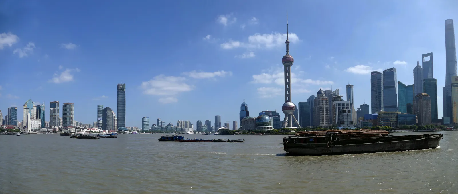Panoramic view across the Huangpu River from the Bund toward the Lujiazui skyline